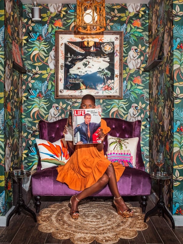 Guest reading magazine at Bon Vivants in the Bahamas