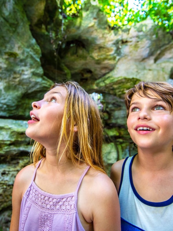 Two kids take in the underground caves in The Bahamas. 