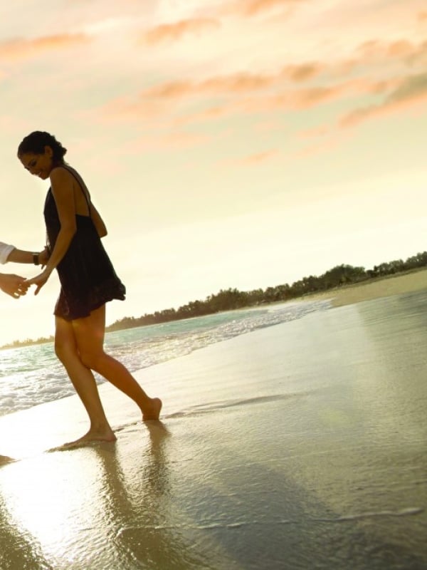 A couple dancing on the beach in Baha Mar