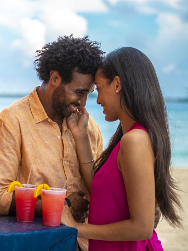 A couple embraces on Junkanoo beach in The Bahamas