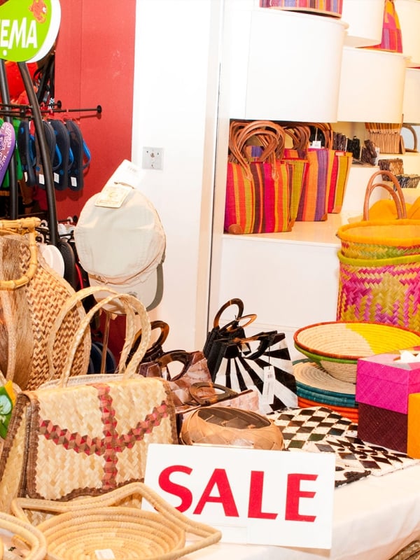 The sale table of a colourful retail store.