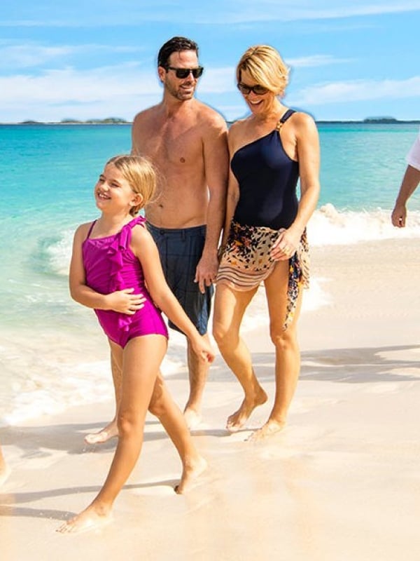 A family stroll along a beautiful beach.