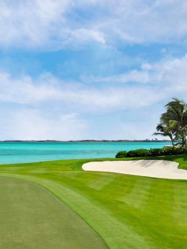 A couple on a golf green in Paradise Island, Bahamas