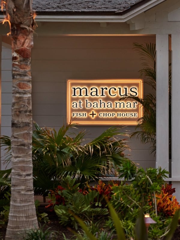 Front door of restaurant with light up sign