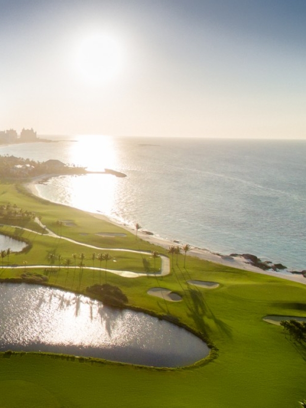 An aerial photo of the Ocean Club Golf Course in The Bahamas at sunrise.