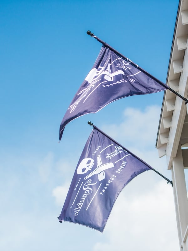 Two pirate flags hang outside the Pirates of Nassau Museum in The Bahamas. 