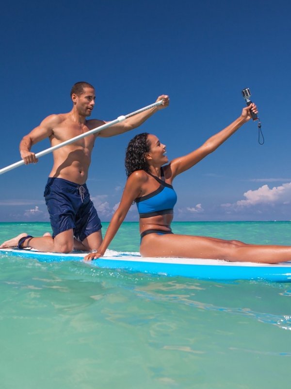 Couple on a SUP taking a selfie