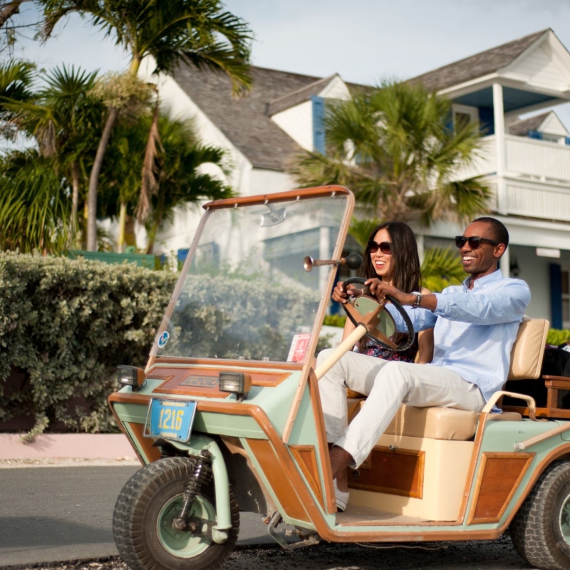 twi people on a golf cart